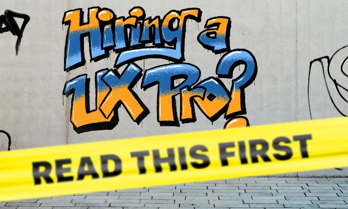 “Hiring a UX Pro?” graffitied on a concrete wall in orange and blue. Yellow caution tape reading “Read This First” is posted in front of the graffiti.