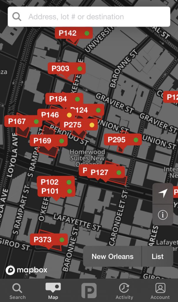 A screenshot of the
  parking app, showing a bunch of red icons on a map, indicating different
  parking spaces. 