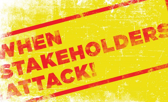 A weatherbeaten sign that says, "When stakeholders attack" in red.