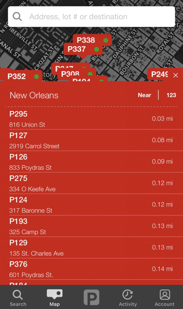 A screenshot of the  parking app. There is a list of options for parking spaces in New Orleans.  They are all similarly named, such as, P129, P295. The street name is below the parking space label. 